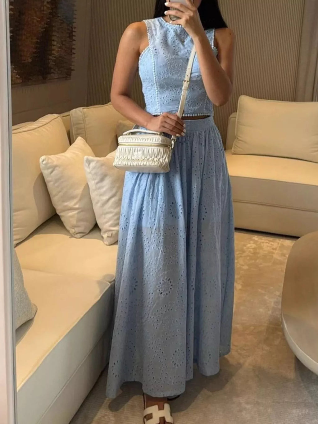 Trendsi eyelet crop top and matching maxi skirt set featuring a stylish crop top and flowy skirt in eyelet fabric.