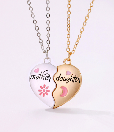 Matching mother-daughter heart magnetic pendant set by Plush Fashion Hub, featuring two interconnected heart pendants with magnetic closures.