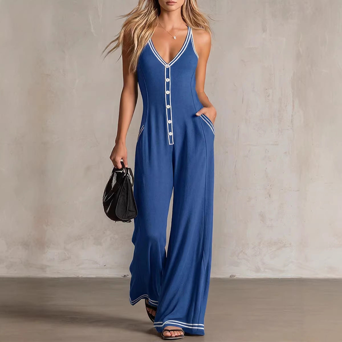 Women's FitiqueFit V-neck backless wide-leg jumpsuit with high waist, casual style, shown on a model in a relaxed pose.