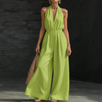 V-neck halter neck jumpsuit for women with sleeveless design, fitted waist, and wide-leg pants, in a stylish and comfortable cut.
