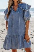 VYSN denim mini dress with puff sleeves, ruffled side pockets, and a fitted silhouette, perfect for casual or stylish outings.