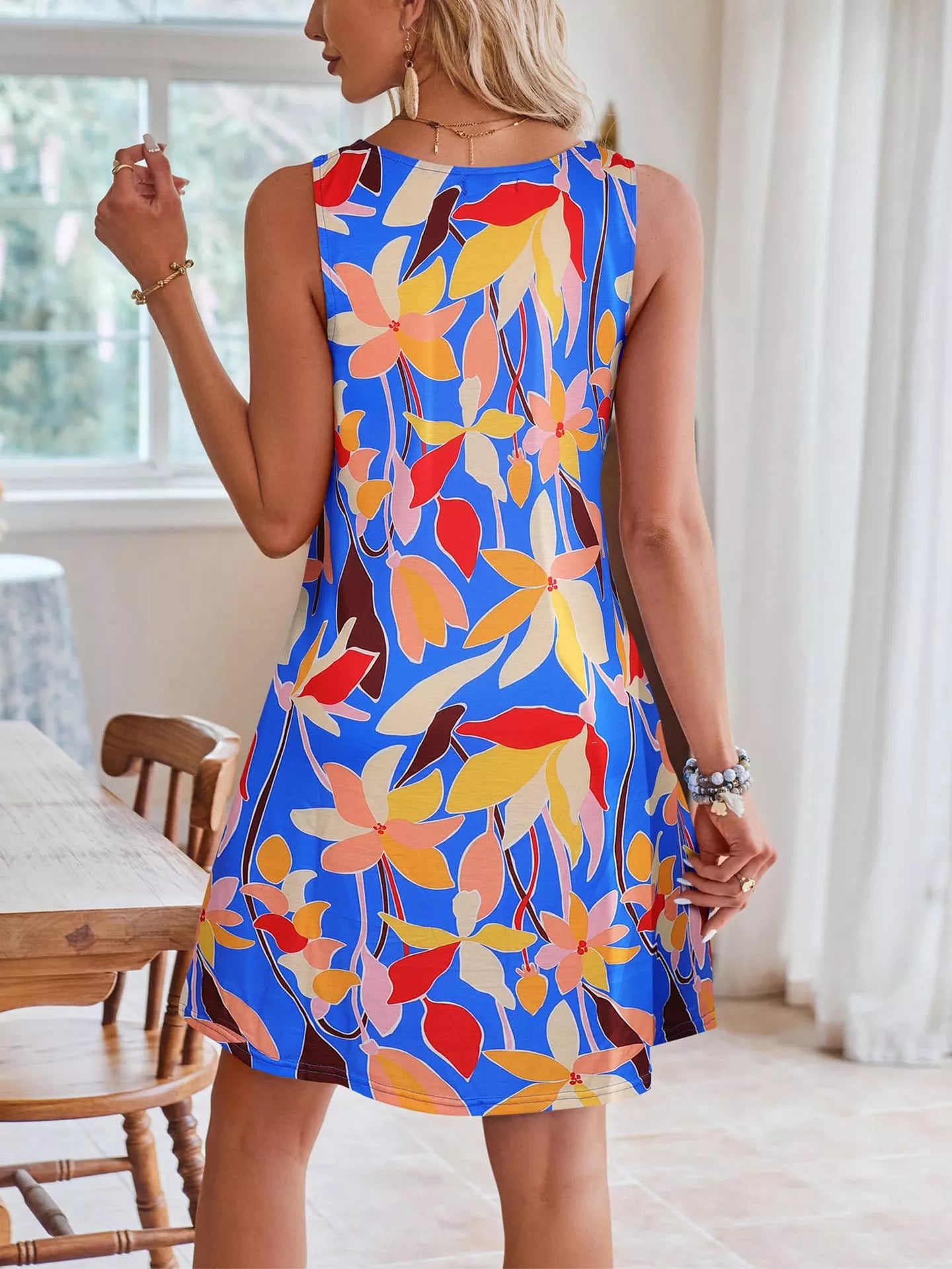 Tropical leaf print V-neck sleeveless dress by Shopimist, lightweight fabric with vibrant green and white leaf patterns.