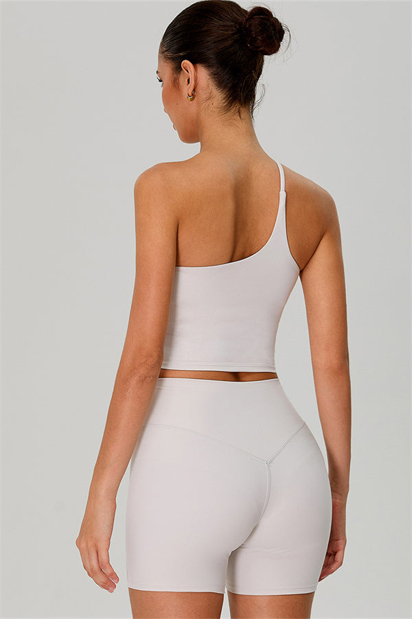 Fitglutes activewear one-shoulder crop top and matching shorts 2-piece set, perfect for gym or workout sessions.