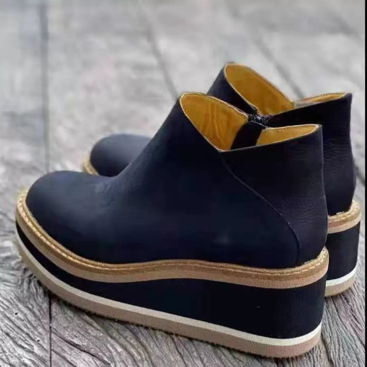 Women's ankle wedge boots with zipper by Trendsi, featuring a stylish design and comfortable heel height.