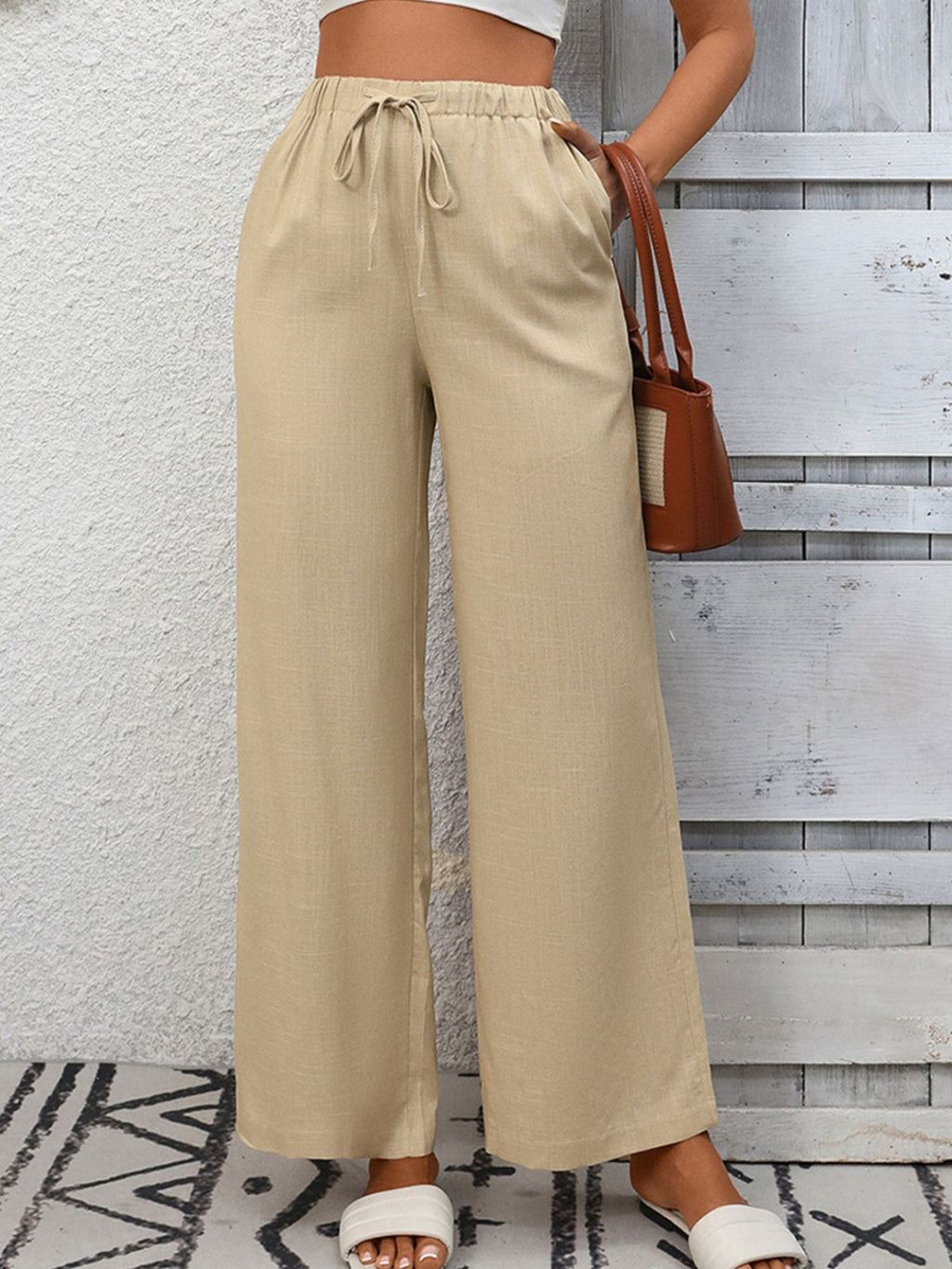 Women's high-waisted wide-leg drawstring pants in soft breathable viscose, stylish and comfortable Trendsi pants shown in the image.