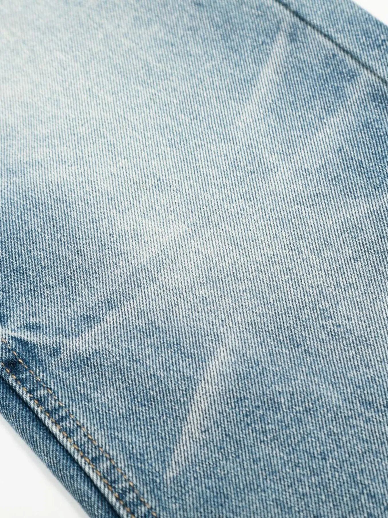 Men's loose fit jeans from Trendsi, showcasing relaxed denim style with a classic five-pocket design and casual fit.