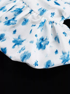 Floral print ruffle hem tank top by Shopimist featuring a sleeveless design and lightweight fabric with a feminine ruffle detail.