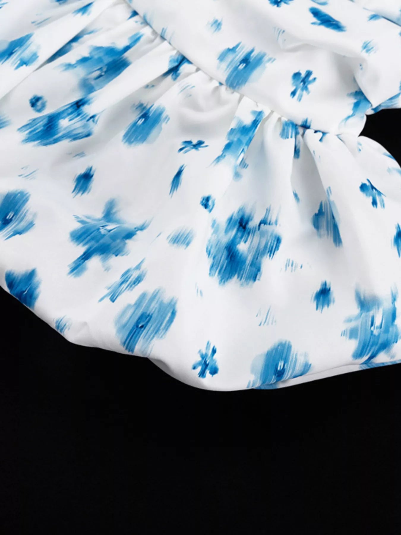 Floral print ruffle hem tank top by Shopimist featuring a sleeveless design and lightweight fabric with a feminine ruffle detail.
