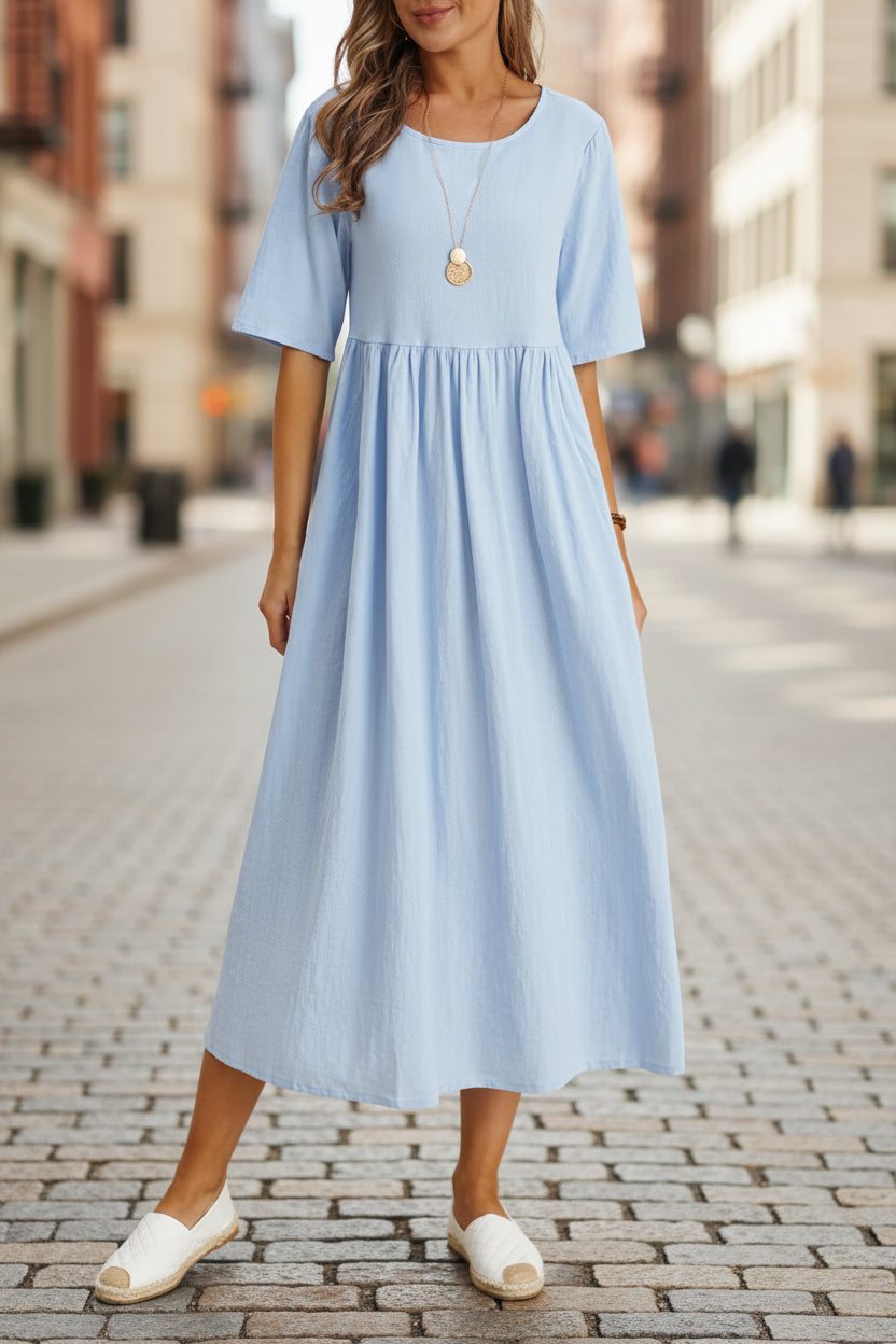 Plus size midi dress by FitiqueFit featuring a round neck, pockets, and casual style, perfect for comfortable everyday wear.