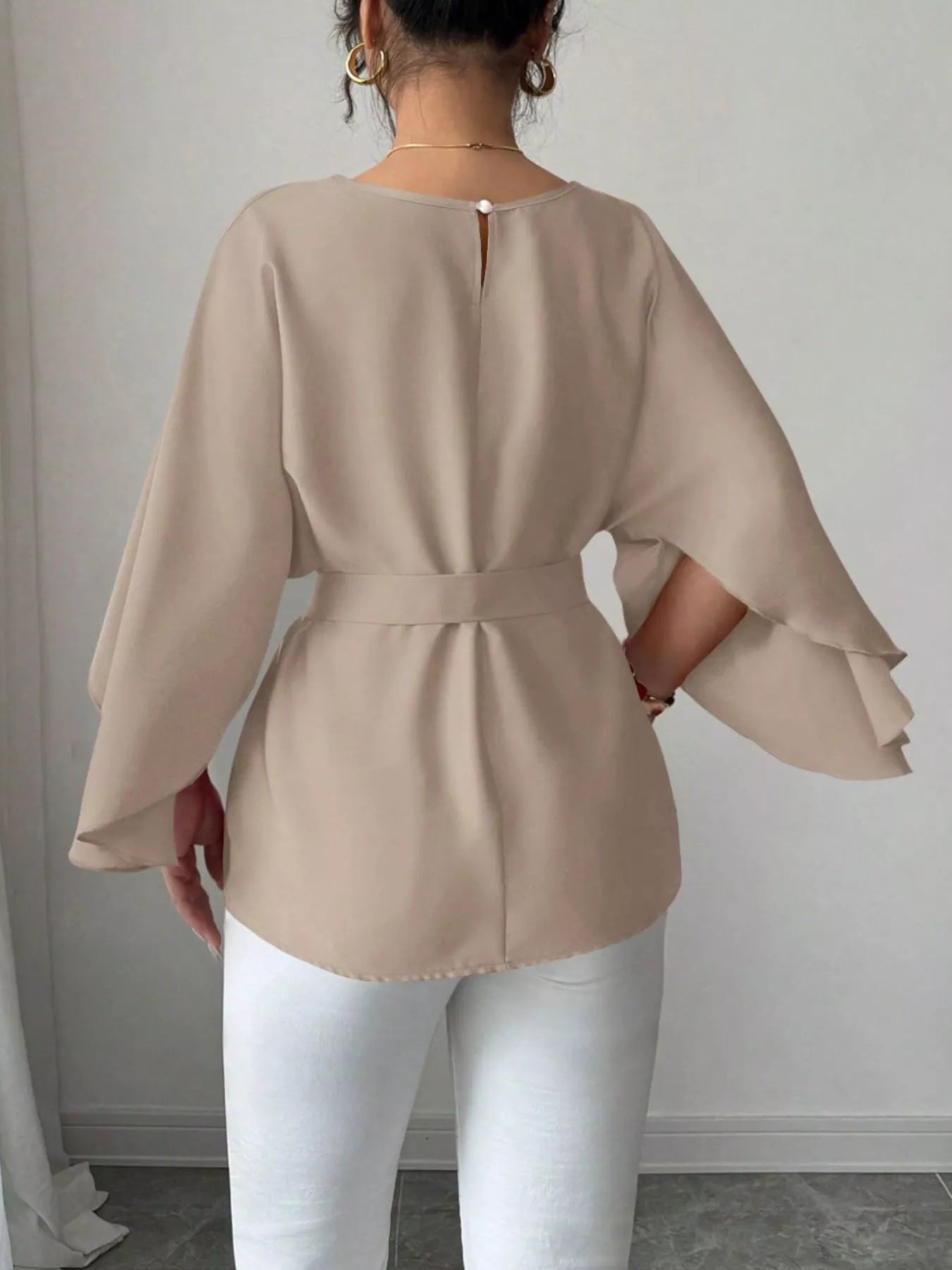Black batwing sleeve belted blouse by Shopimist, featuring a relaxed fit and stylish design, shown on a hanger.