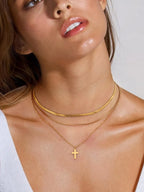 18K gold-plated three-layered cross necklace with delicate chains and detailed cross pendants, displayed on a neutral background.
