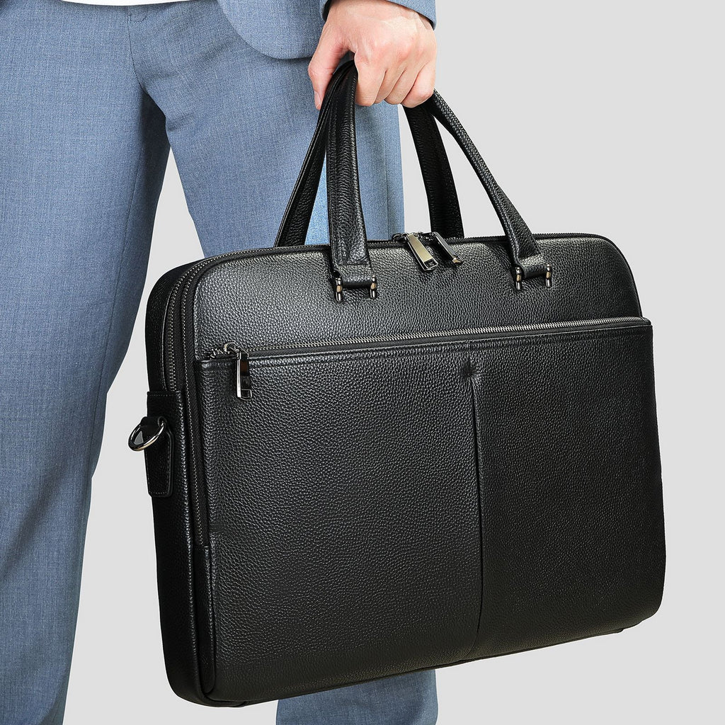 Large capacity men's horizontal briefcase by Plush Fashion Hub, made of cowhide, holds a 17-inch computer and essentials.