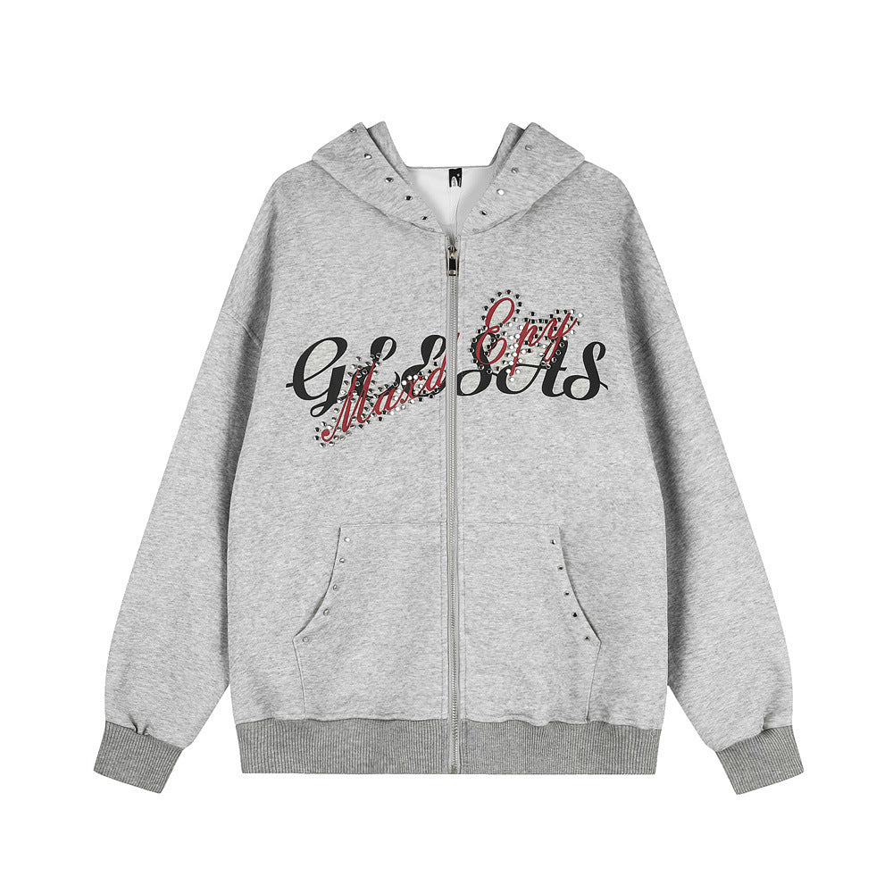 Gray cotton zip-up hoodie with black and red rhinestone text, hood studs, and front pockets.