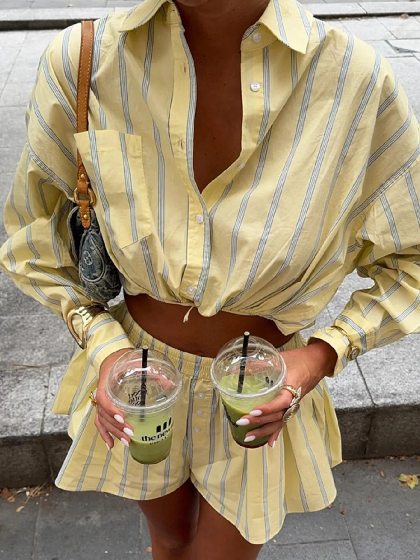 Striped button-up shirt and shorts set by Plush Fashion Hub, featuring a casual, coordinated summer outfit for women.