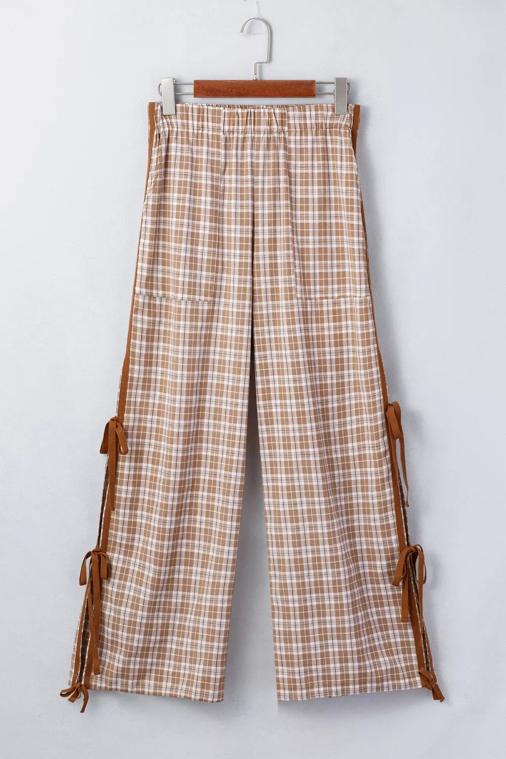 Plaid print casual pants with tie detail from Plush Fashion Hub, featuring a relaxed fit and stylish plaid pattern.