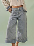 Wide-leg cropped denim jeans by Plush Fashion Shop, featuring a relaxed fit and stylish design, shown on a model.