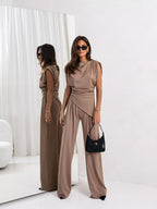 Satin cowl neck top and matching pants set by Shopimist, featuring a smooth, shiny fabric and relaxed fit.