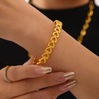 18K gold-plated stainless steel heart bracelet with delicate chain and charm, elegant jewelry accessory.