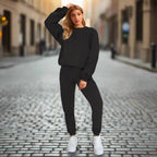 Women's solid color round neck sweatshirt and pants set by Plush Fashion Hub, casualwear with a comfortable fit.