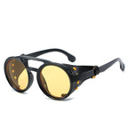 Round steampunk sunglasses by FitiqueFit featuring vintage-inspired design and metal frames, perfect for a bold, fashionable look.