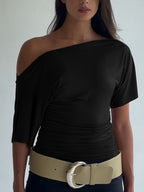 Women's one shoulder ruched short sleeve T-shirt by Trendsi, showcasing chic stretch top with fitted style and stylish asymmetric design.