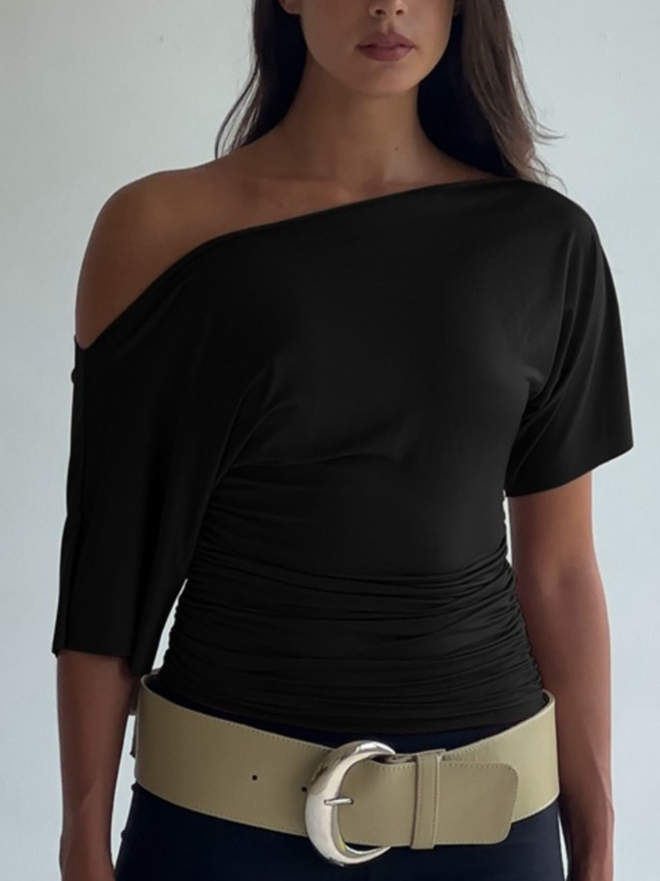 Women's one shoulder ruched short sleeve T-shirt by Trendsi, showcasing chic stretch top with fitted style and stylish asymmetric design.