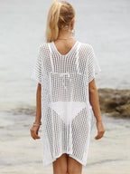 Openwork V-neck slit cover-up by Trendsi featuring lightweight fabric and stylish design, perfect for beach or poolside wear.