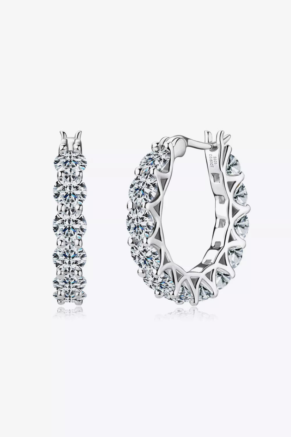 Sterling silver moissanite earrings with 7.2 carats, featuring sparkling round-cut gemstones in a classic stud design