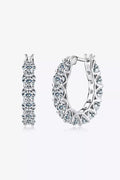 Sterling silver moissanite earrings with 7.2 carats, featuring sparkling round-cut gemstones in a classic stud design