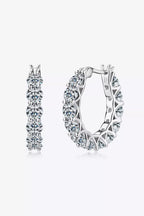 Sterling silver moissanite earrings with 7.2 carats, featuring sparkling round-cut gemstones in a classic stud design
