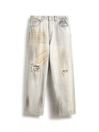 Men's distressed wide leg jeans by Trendsi, featuring ripped details and relaxed fit, shown on a model.