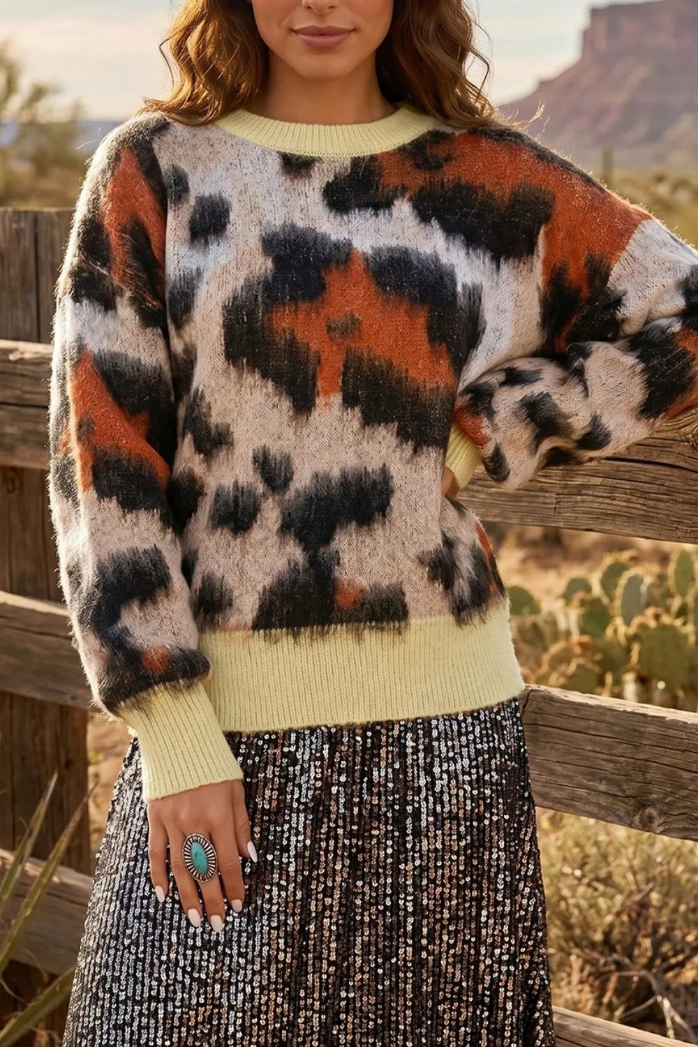 Leopard print drop shoulder long sleeve sweater with round neck from Trendsi, casual and cozy women's knitwear.