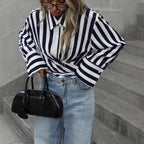 Women's striped long-sleeve loose shirt by FitiqueFit, featuring a relaxed fit and stylish horizontal stripe pattern.