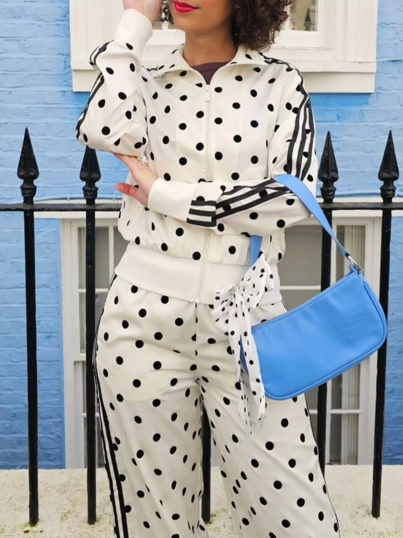 Polka dot zip-up outerwear and pants matching set by Plush Fashion Hub, featuring a playful polka dot pattern and casual style.