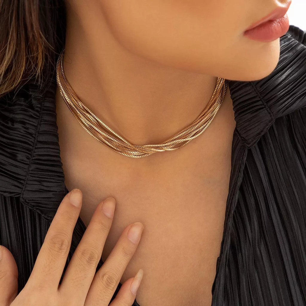 Multi-layered adjustable necklace from Shopimist with delicate chains and versatile style, displayed against a neutral background.