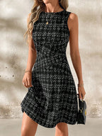 Round neck sleeveless dress by Shopimist, featuring a fitted bodice and flowing skirt, styled for casual or summer wear.
