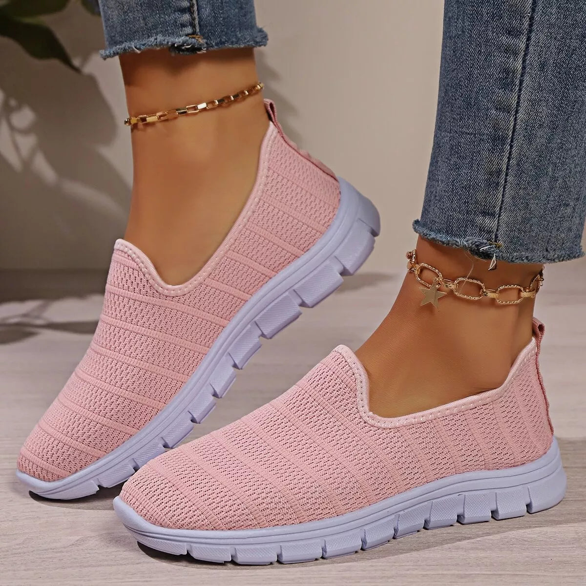 Women's breathable mesh slip-on casual flats by Trendsi, lightweight comfortable walking shoes with a sleek design.