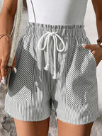 Women's striped elastic waist drawstring shorts by Plush Fashion Hub, casual summer beachwear, featuring breathable fabric and relaxed fit.