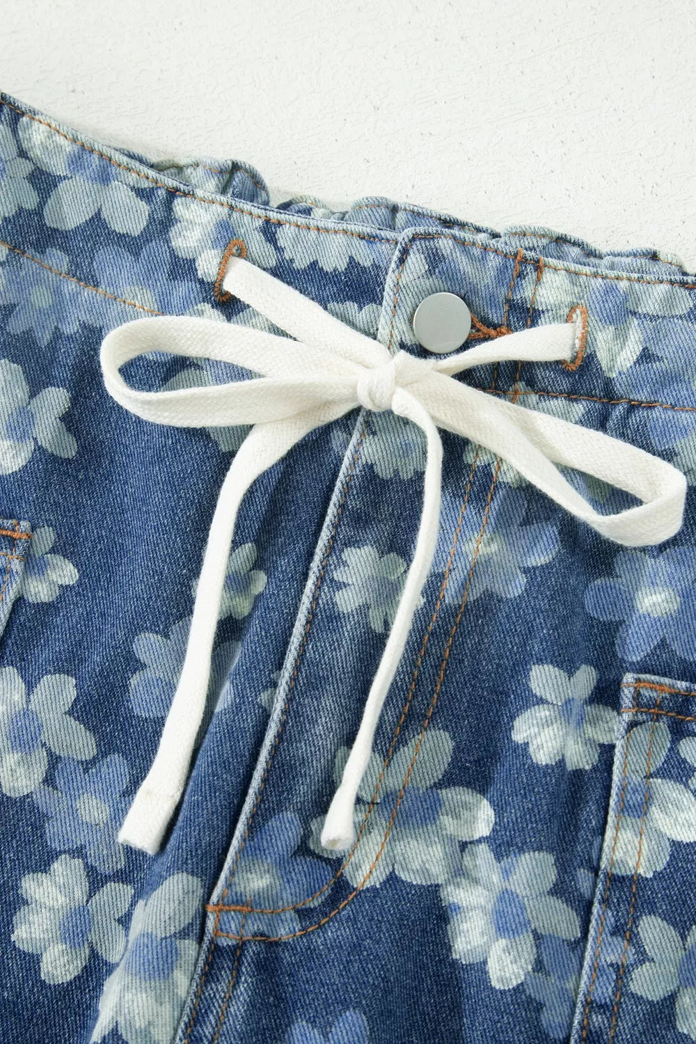 Dainty floral printed drawstring barrel jeans from Plush Fashion Hub, showcasing the floral pattern and relaxed fit.