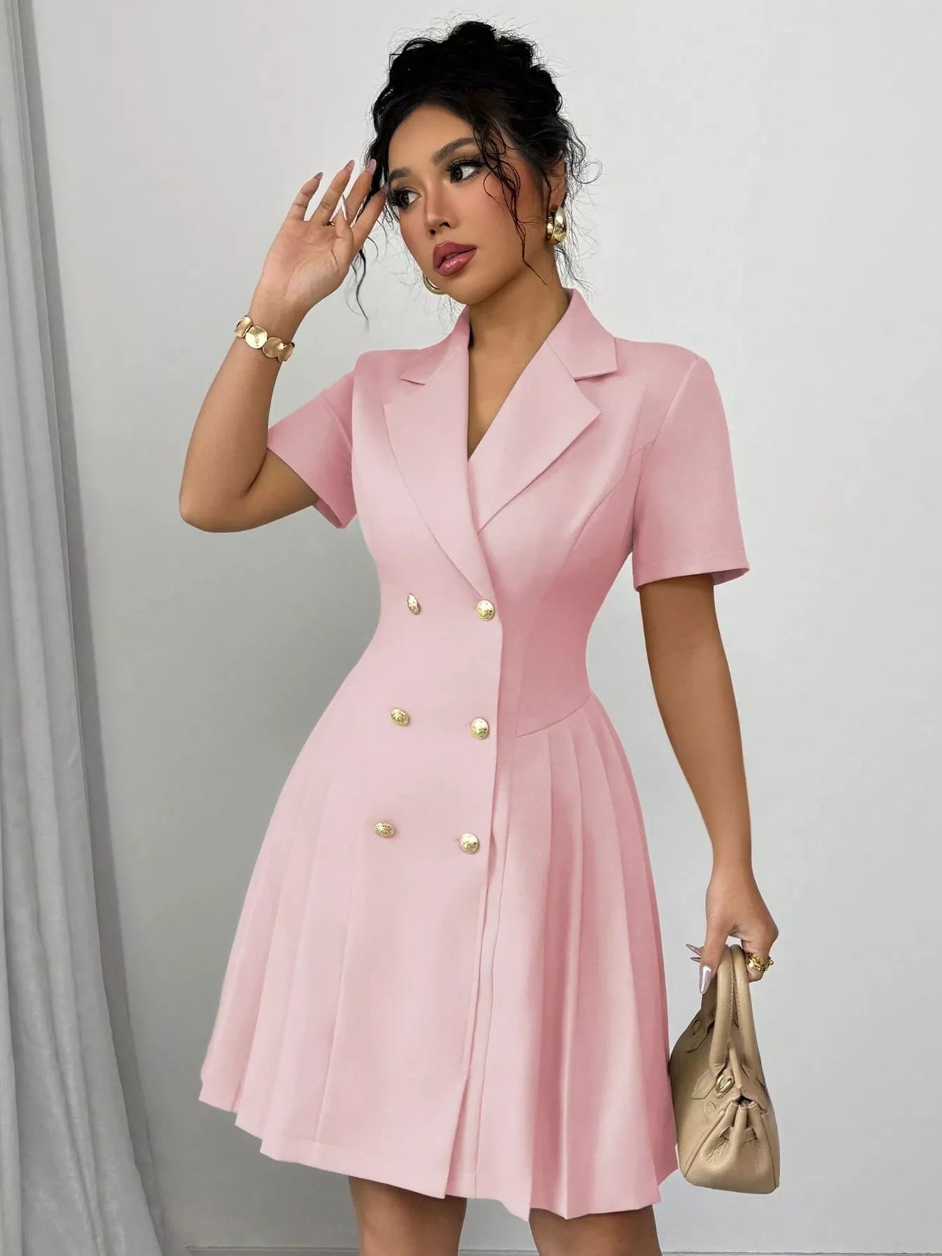 Plush Fashion Hub double-breasted pleated blazer dress with structured design, lapels, and tailored fit, shown in a stylish silhouette.