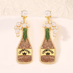 Champagne bottle earrings with pearl accents, stylish jewelry accessory from Shopimist, featuring detailed design and elegant charm.