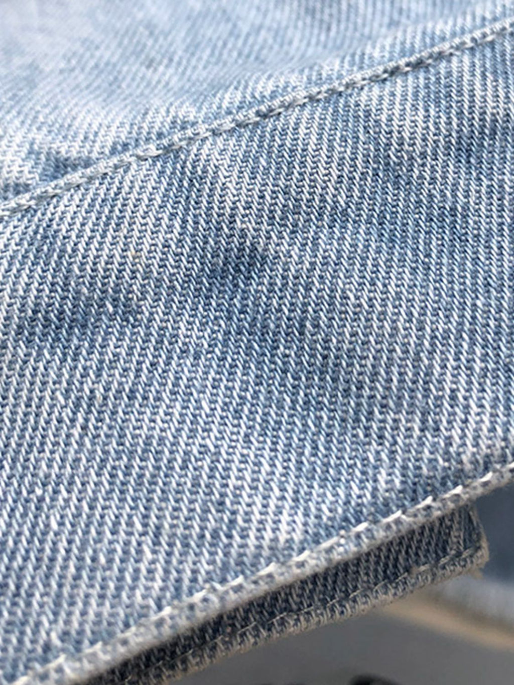 VYSN raw hem collared neck long sleeve denim jacket with classic style and button front, displayed on a hanger.