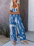 Plus size tie-dye wide leg jumpsuit from Shopimist featuring vibrant colors and a relaxed fit, full-length design.