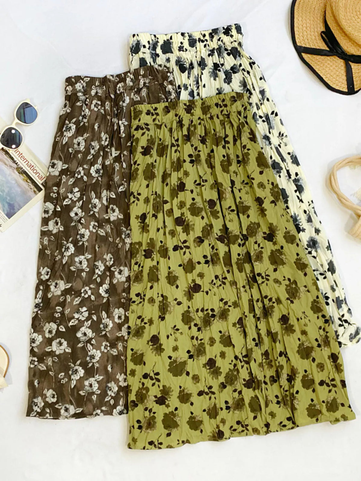 Floral print elastic waist midi skirt by Plush Fashion Hub, featuring a flowy design and vibrant floral pattern.