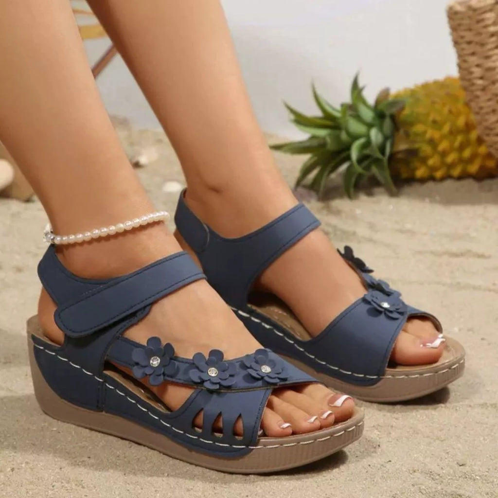 Floral embellished Shopimist wedge sandals with open toes and ankle straps, featuring colorful flower details on the straps.