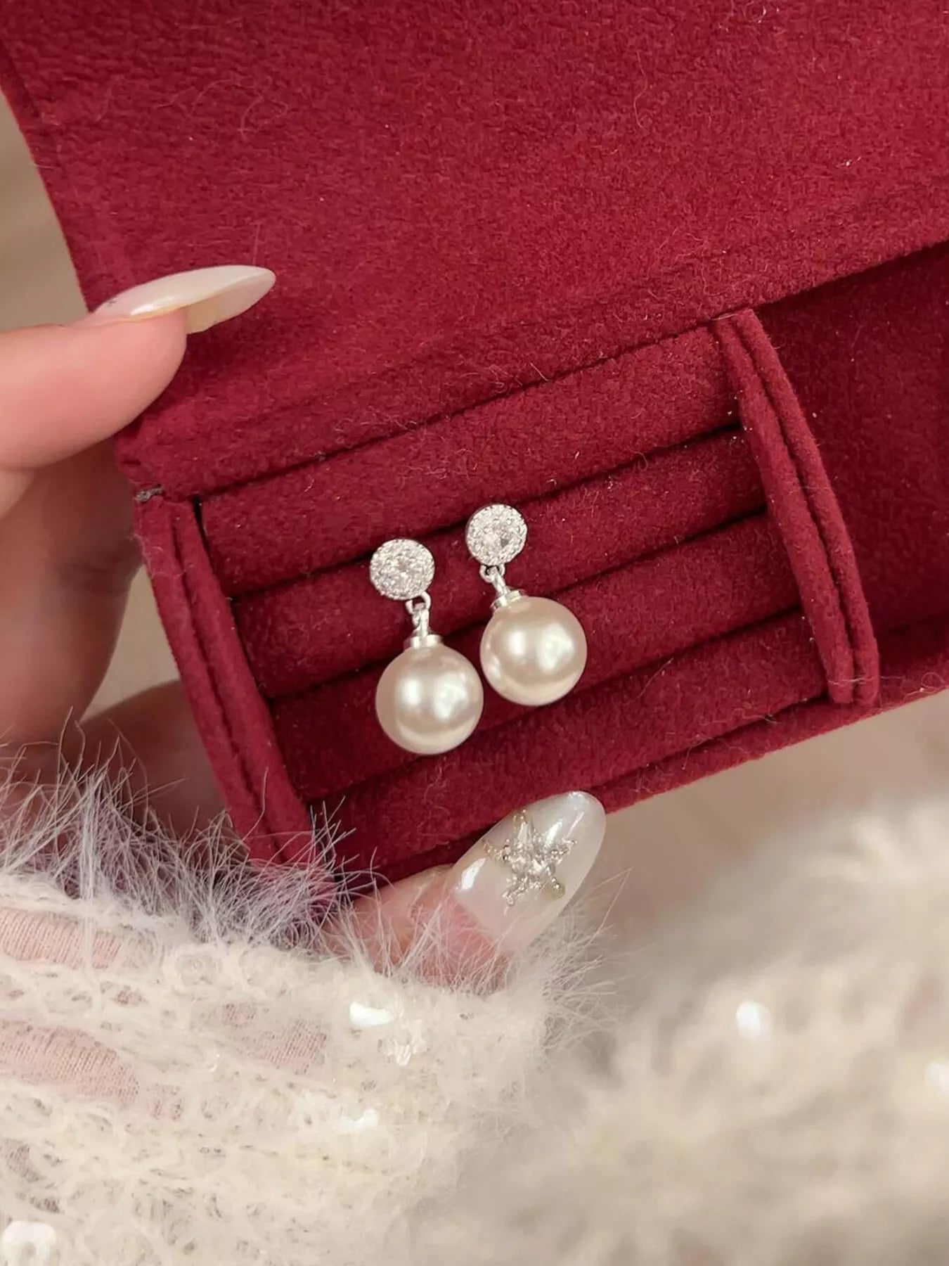 Elegant classic pearl drop earrings by Plush Fashion Hub featuring lustrous pearls and delicate hooks.