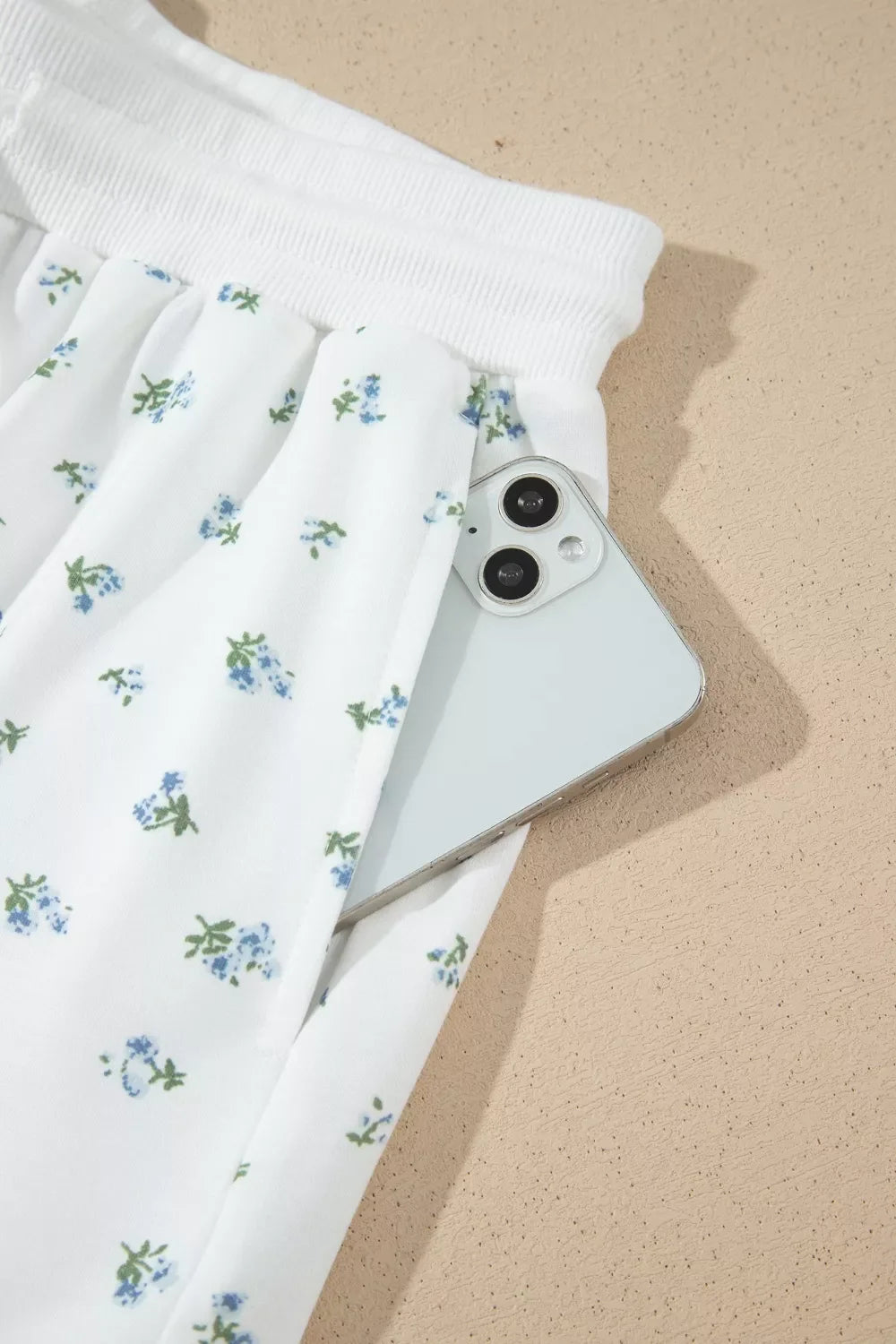 Floral print half zip top and matching shorts set by Shopimist, casual loungewear with vibrant floral design, front zip detail.
