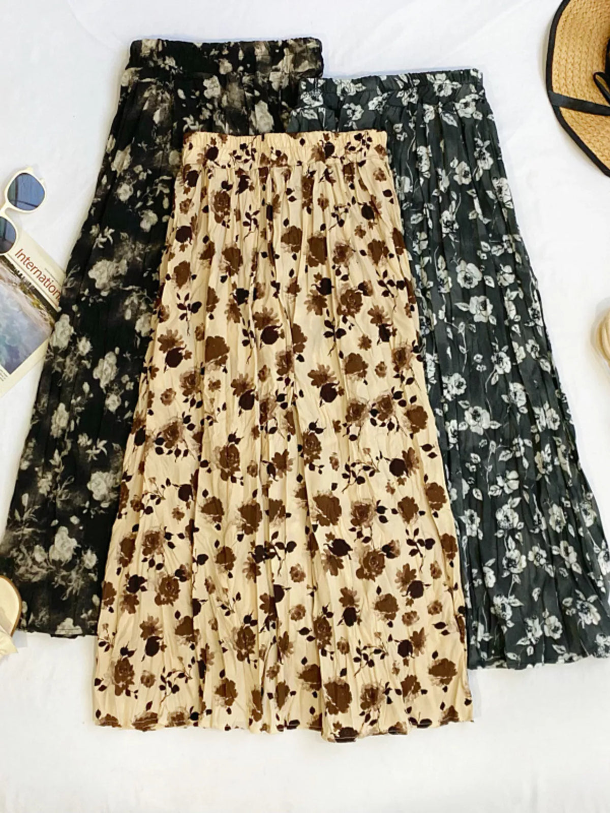 Floral print elastic waist midi skirt by Plush Fashion Hub, featuring a flowy design and vibrant flower patterns.