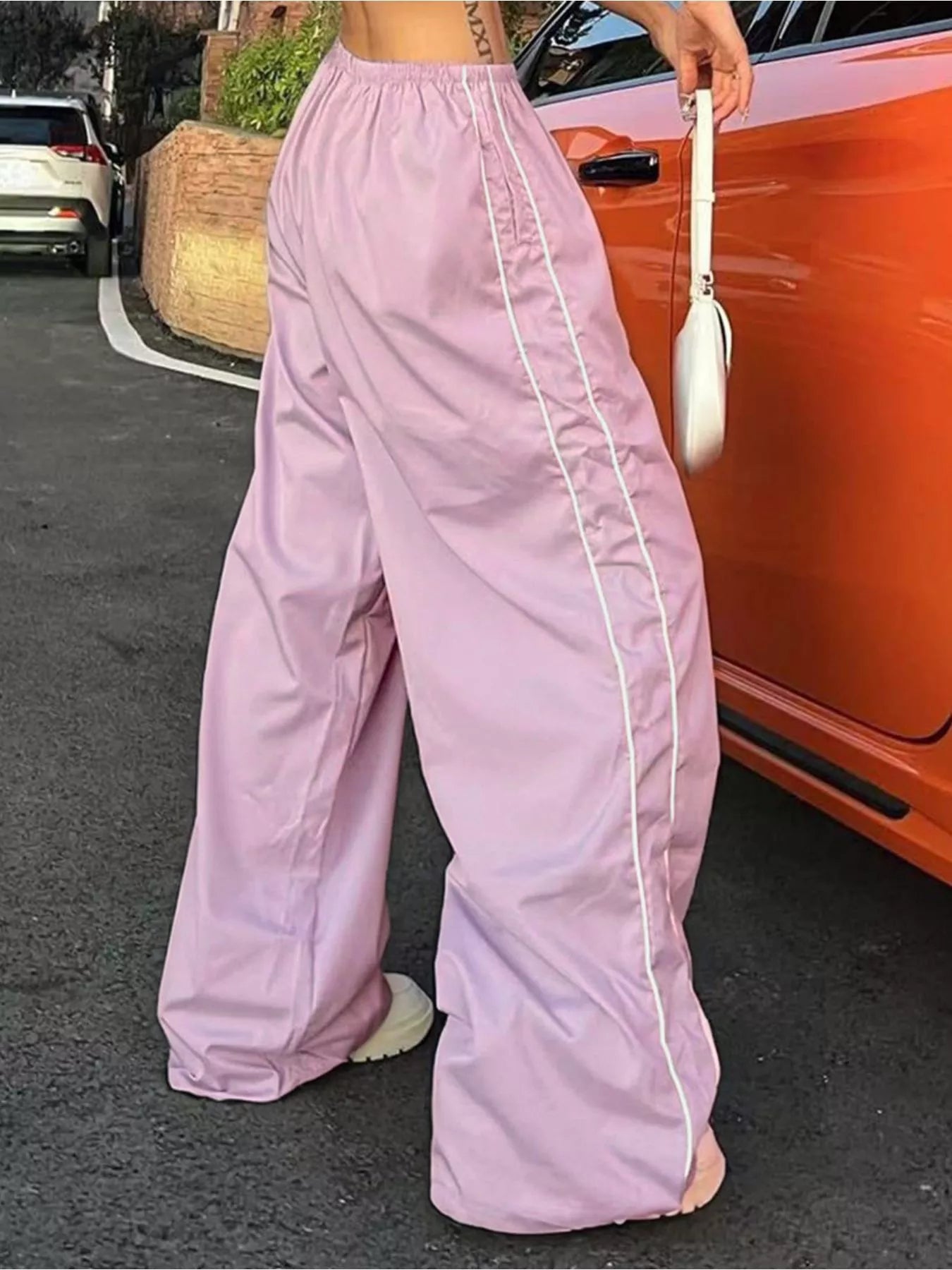 Lightweight women's high-rise wide-leg dress trousers with elastic waistband, stylish and comfortable for casual or dressy wear.