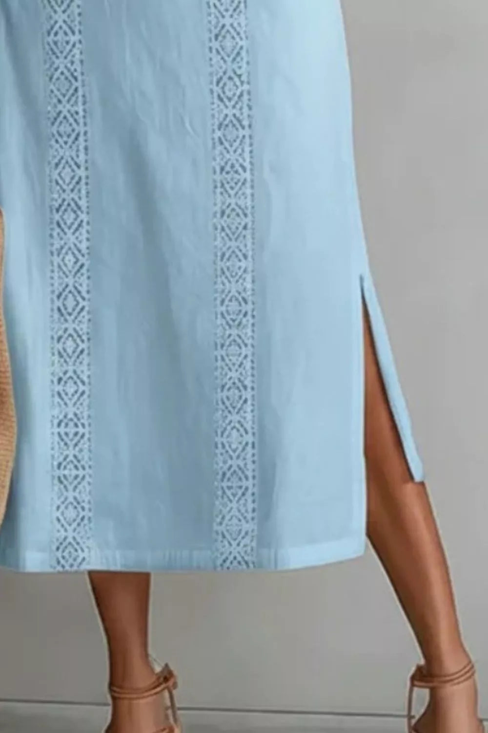 Women's sleeveless side slit maxi dress with pockets by Plush Fashion Hub, featuring a flowing design and comfortable fit.